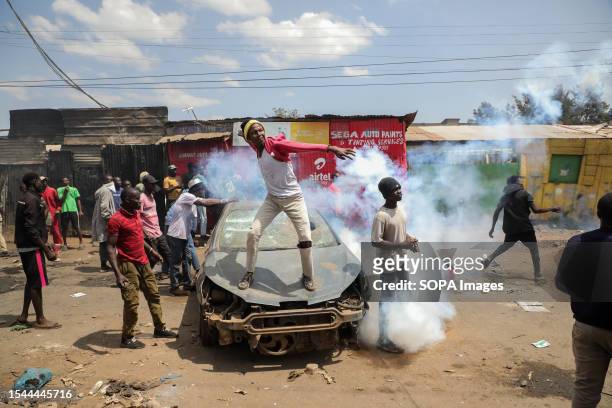 Protesters throw stones at police during the day two of a protest called Azimio party leader Raila Odinga over the high cost of living in Kibera...