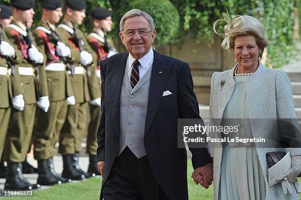 King Constantine of Greece and Queen Anne Marie of Greece emerge from the Cathedral following the wedding ceremony of Prince Guillaume Of Luxembourg...