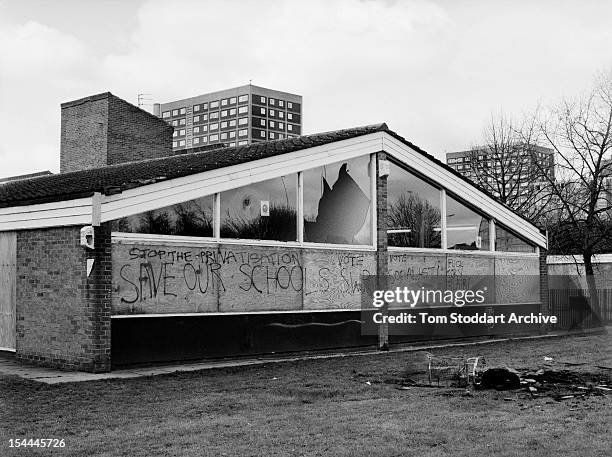 North Manchester school that has had windows broken by vandals and been defaced with anti-government and anti-Tony Blair graffiti, 2000.