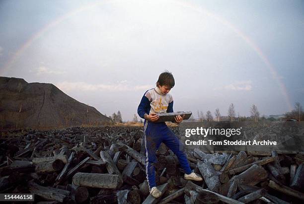 Twelve year-old Michael Hiller playing on the uranium waste site at Crossen, near Zwickau, East Germany, 1991.