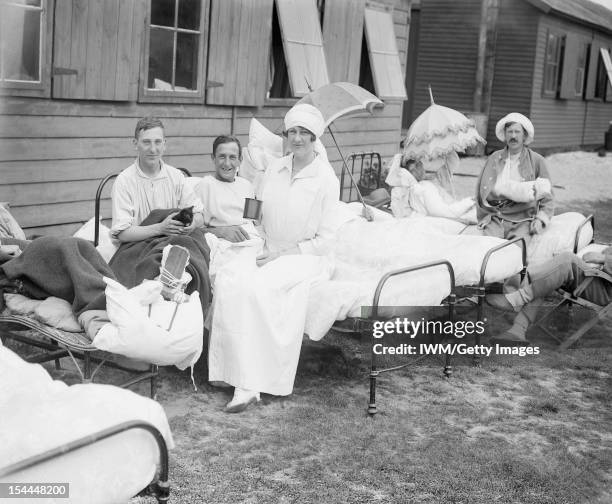 Ministry Of Information First World War Official Collection, The Duchess of Sutherland sitting with patients at her hospital at Calais during July...