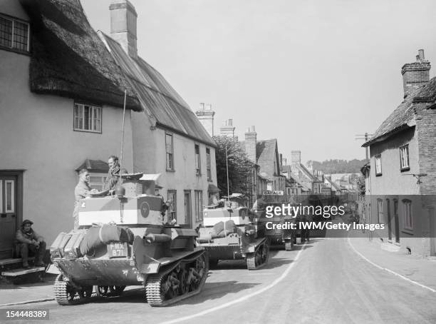 The British Army In The United Kingdom 1939-45, Vickers Mk VI light tanks pass through the village of Linton in Cambridgeshire, 30 August 1940.
