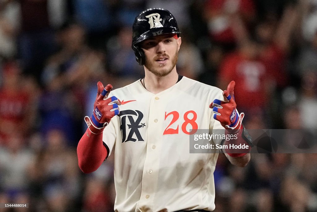 Texas Ranger Heim Jonah Heim of the Texas Rangers gestures to his dugout after hitting ...