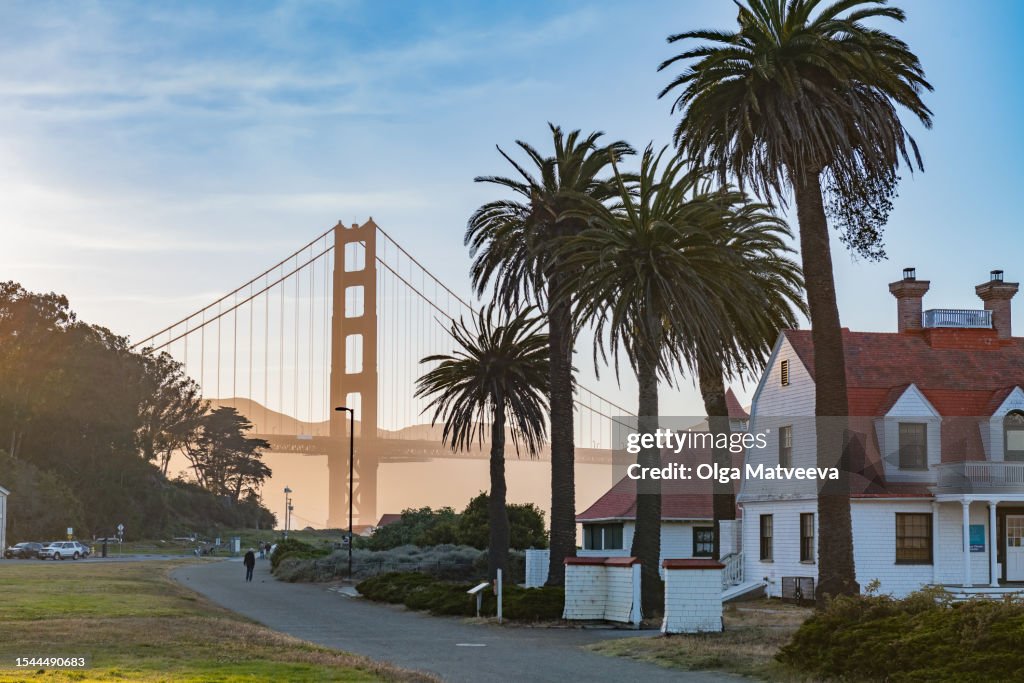 Houses Palm Trees Golden Gate Bridge at Sunset on a warm summer evening