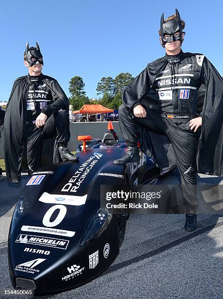 Gunnar Jeannette of the United States and Lucas Ordonez of Spain, drivers of the DelltaWing Nissan, pose on the grid prior to the start of the...