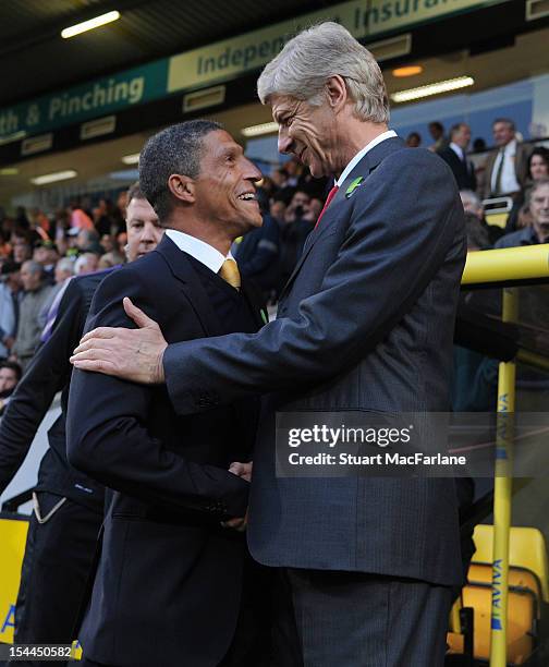 Arsenal manager Arsene Wenger with Norwich manager Chris Hughton before the Barclays Premier League match between Norwich City and Arsenal at Carrow...