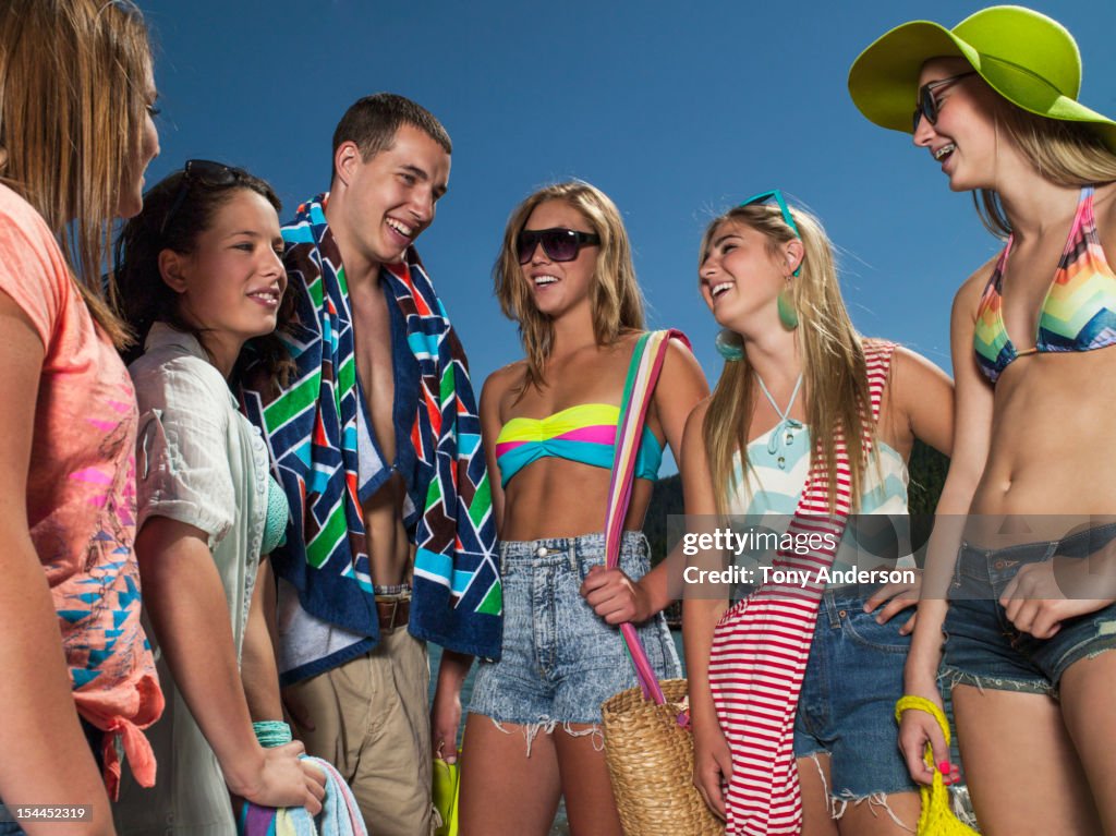 Friends laughing together at the beach