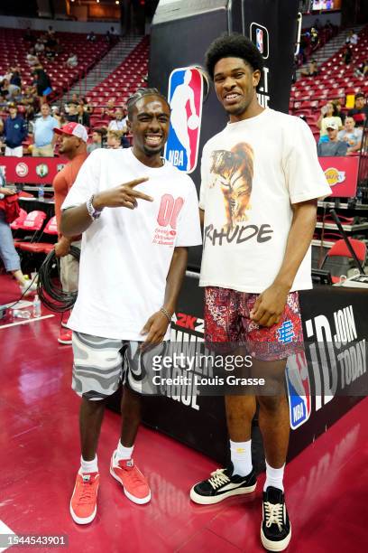 Actor Caleb McLaughlin and Scoot Henderson of the Portland Trail Blazers pose for a picture at a 2023 NBA Summer League game between the Portland...