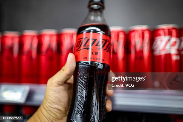 Man holds a bottle of sugar-free Coca Cola on July 14, 2023 in Shaoxing, Zhejiang Province of China.