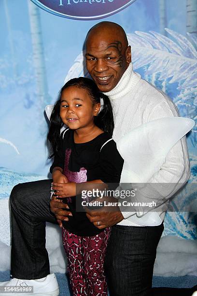 Mike Tyson and daughter Milan Tyson attend "Secret Of Wings" premiere at AMC Loews Lincoln Square on October 20, 2012 in New York City.