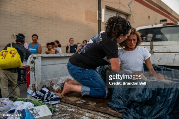 Person is baptized in a section of 'The Zone' encampment on July 14, 2023 in Phoenix, Arizona. Sections of Phoenix's largest homeless encampment 'The...