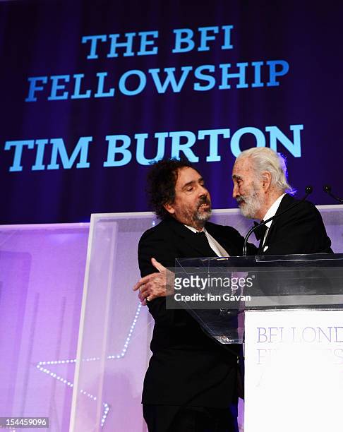 Director Tim Burton receives the BFI Fellowship award from Sir Christopher Lee during the 56th BFI London Film Festival Awards at the Banqueting...