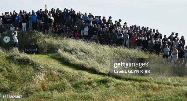 Golfer Taylor Moore plays from the 14th tee on day one of the 151st British Open Golf Championship at Royal Liverpool Golf Course in Hoylake, north...