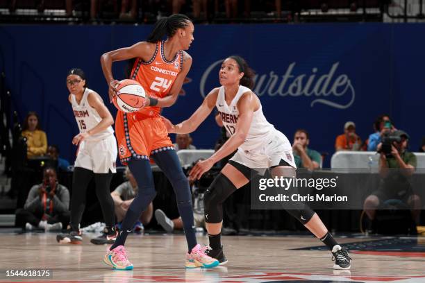 Nia Coffey of the Atlanta Dream plays defense against DeWanna Bonner of the Connecticut Sun during the game on July 20, 2023 at the Mohegan Sun Arena...