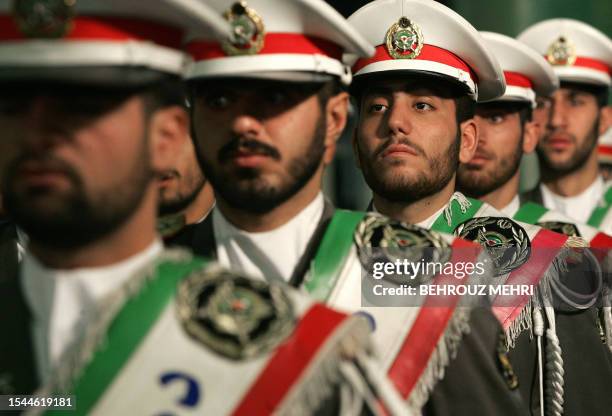 Iranian protocol soldiers stand guard during a ceremony to mark the 27th anniversary of the Islamic revolution at the mausoleum of Iran's late...