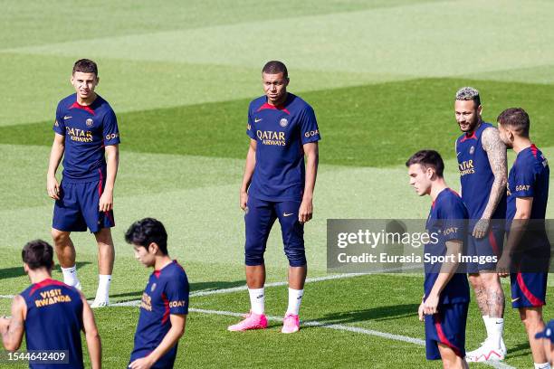 Kylian Mbappe of Paris Saint Germain warming up with his teammates during the Paris Saint-Germain training session on July 20, 2023 in Poissy, France.