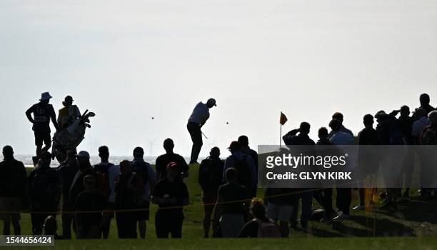 Golfer Ben Griffin chips onto the 13th green on day one of the 151st British Open Golf Championship at Royal Liverpool Golf Course in Hoylake, north...