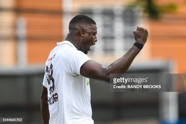 Jason Holder of West Indies celebrates the dismissal of Yashasvi Jaiswal of India during the first day of the second Test cricket match between India...