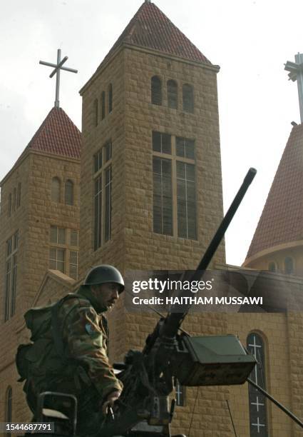 Lebanese troops take position in front of a church at the scene of Christian a demonstration in the village of Kahaleh, in the mountains east of...