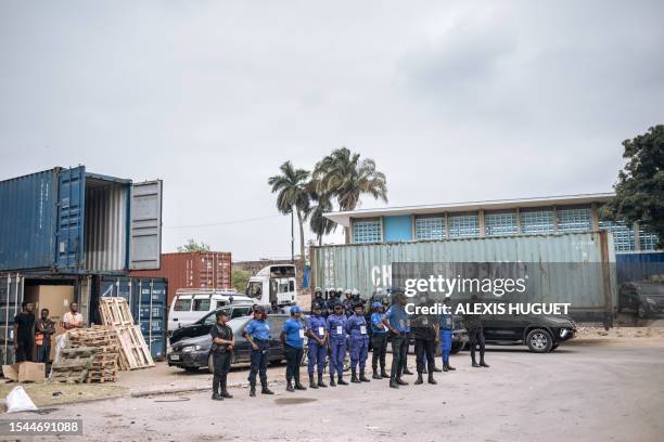Security guards and police await a delegation of Congolese ministers and ambassadors visiting the construction site of the "Jeux de la Francophonie...