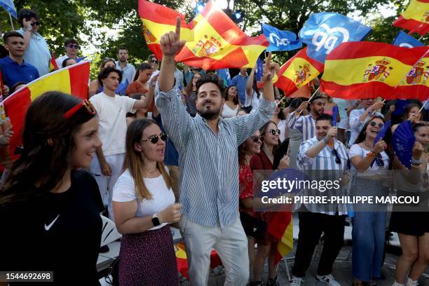 Supporters cheer prior a campaign meeting of Spanish right-wing opposition party Partido Popular leader in Madrid on July 20, 2023 ahead of July 23...
