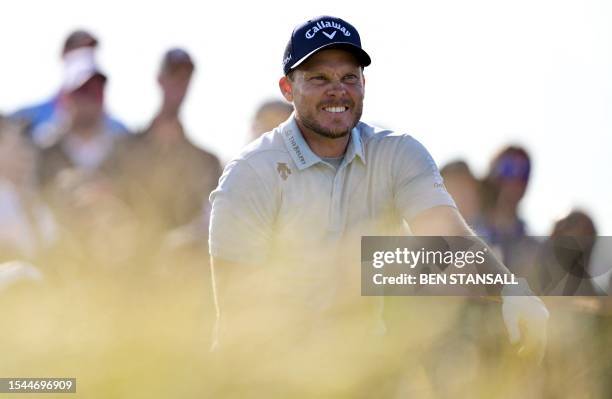 England's Danny Willett watches his drive from the 15th tee on day one of the 151st British Open Golf Championship at Royal Liverpool Golf Course in...