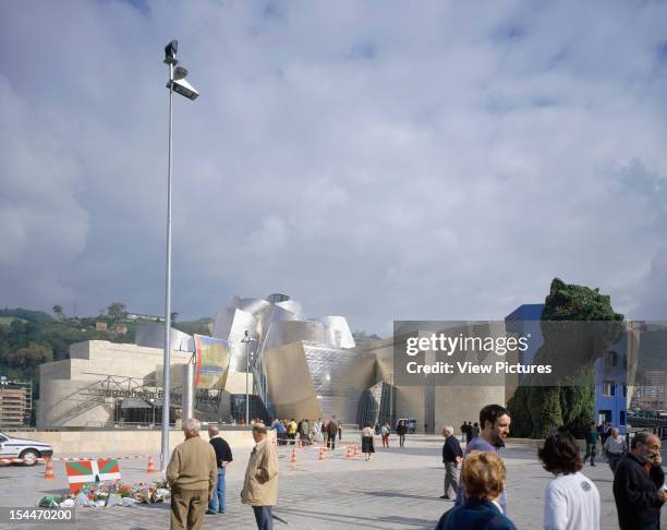 Guggenheim Museum, Bilbao, Spain, Architect Frank Gehry Guggenheim Museum General Exterior With Busy Square, And Jeff Koons 'Giant Puppy'
