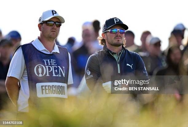 Scotland's Ewen Ferguson talks with his caddie on the 15th tee on day one of the 151st British Open Golf Championship at Royal Liverpool Golf Course...