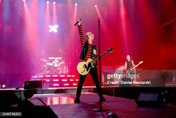 Tré Cool, Billie Joe Armstrong, and Mike Dirnt of Green Day perform onstage during the Harley-Davidson's Homecoming Festival - Day 1 at Veterans Park...