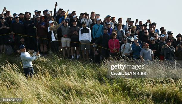 Northern Ireland's Rory McIlroy watches his drive from the 14th tee on day one of the 151st British Open Golf Championship at Royal Liverpool Golf...