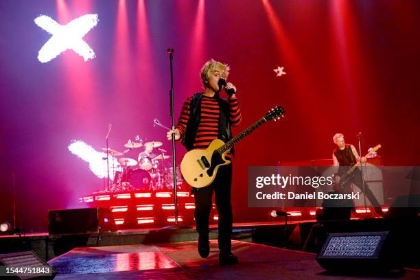 Tré Cool, Billie Joe Armstrong, and Mike Dirnt of Green Day perform onstage during the Harley-Davidson's Homecoming Festival - Day 1 at Veterans Park...