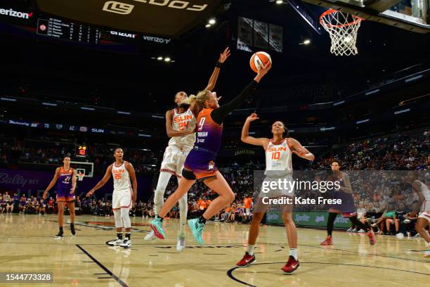 Sophie Cunningham of the Phoenix Mercury drives to the basket during the game against the Connecticut Sun on July 18, 2023 at Footprint Center in...