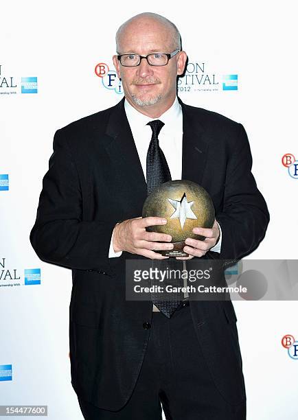 Director and screenwriter of Mea Maxima Culpa: Silence in the House of God, Alex Gibney with the Grierson award for Best Documentary during the 56th...
