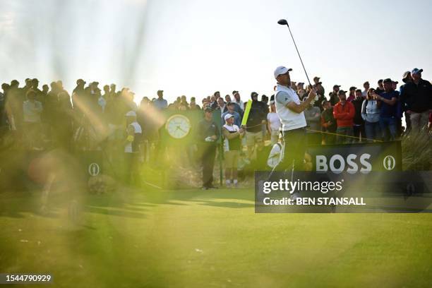 Canada's Nick Taylor watches his drive from the 15th tee on day one of the 151st British Open Golf Championship at Royal Liverpool Golf Course in...