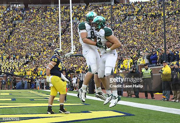 Paul Lang of the Michigan State Spartans celebrates after scoring on a 2 yard pass from Andrew Maxwell during the third quarter of the game against...
