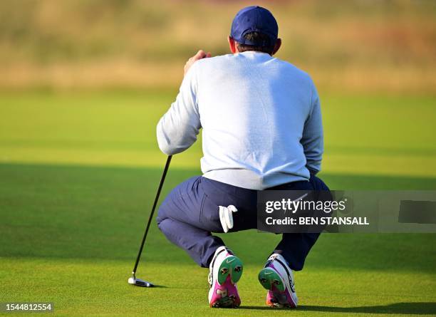 Northern Ireland's Rory McIlroy lines up a putt on the 17th green on day one of the 151st British Open Golf Championship at Royal Liverpool Golf...