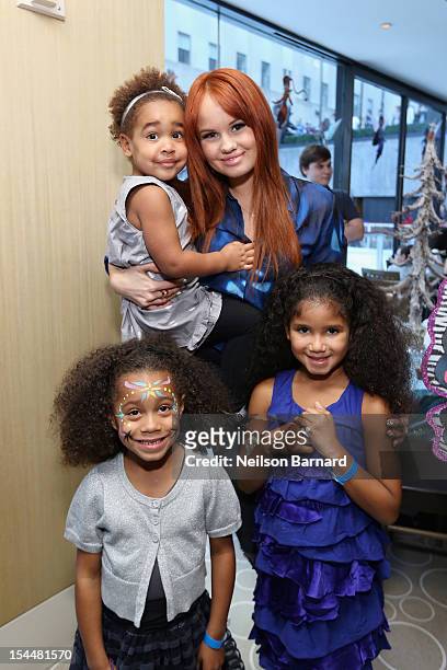 Debbie Ryan poses with guests at the New York premiere of Disney's "Secret Of The Wings" reception at Rockefeller Center on October 20, 2012 in New...