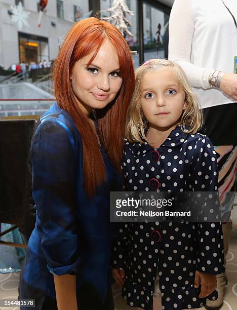 Debbie Ryan poses with a guest at the New York premiere of Disney's "Secret Of The Wings" reception at Rockefeller Center on October 20, 2012 in New...