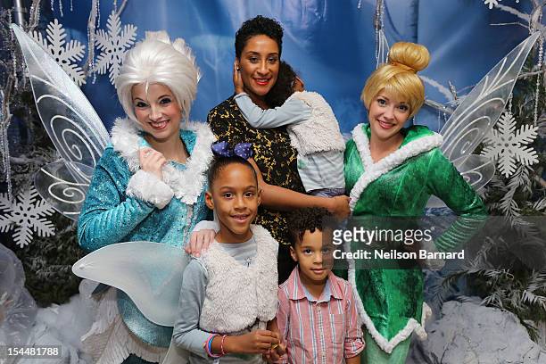 Kimberly Chandler and her children pose at the New York premiere of Disney's "Secret Of The Wings" reception at Rockefeller Center on October 20,...