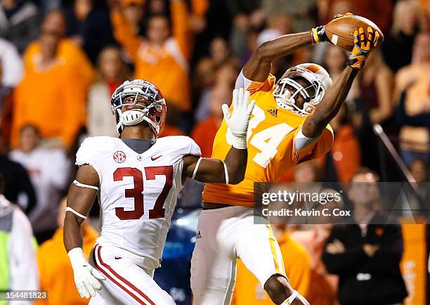 Cordarrelle Patterson of the Tennessee Volunteers pulls in this reception against Robert Lester of the Alabama Crimson Tide at Neyland Stadium on...