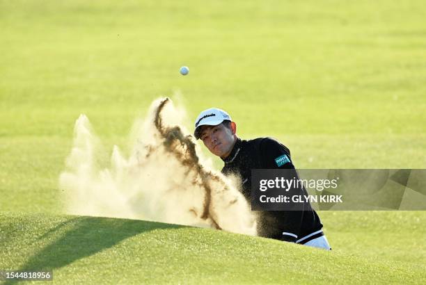 Japan's Keita Nakajima plays out of a bunker onto the 18th green on day one of the 151st British Open Golf Championship at Royal Liverpool Golf...