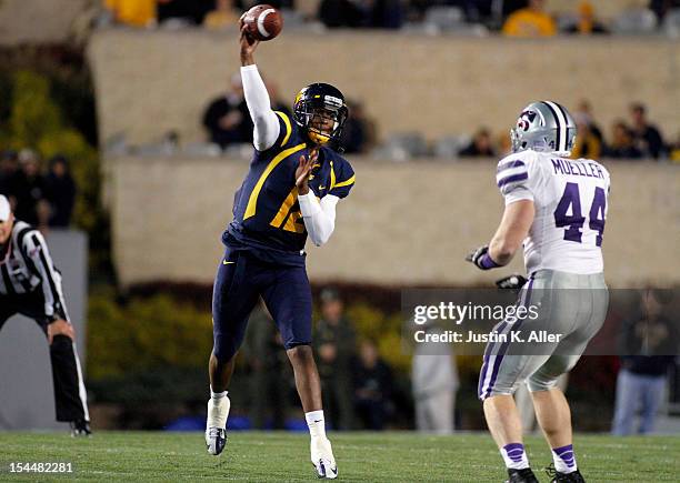 Geno Smith of the West Virginia Mountaineers drops back to pass against the Kansas State Wildcats during the game on October 20, 2012 at Mountaineer...