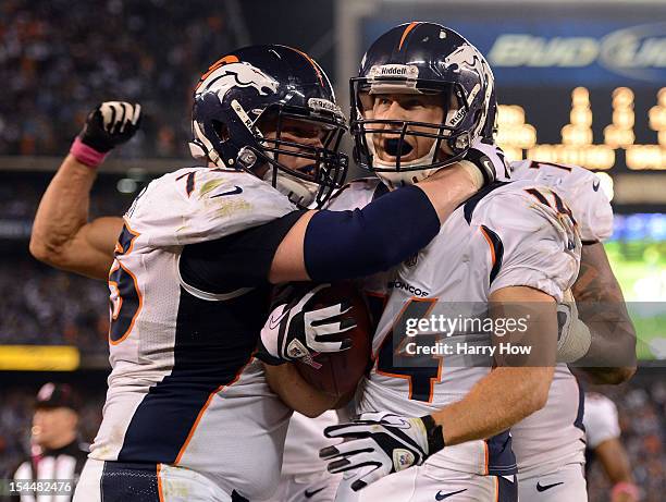 Brandon Stokley of the Denver Broncos celebrates his touchdown with Chris Kuper, Eric Decker and Orlando Franklin to take a 28-24 lead over the San...
