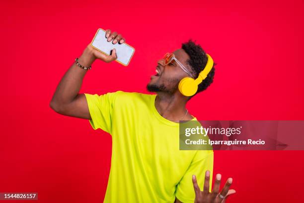rapper holding microphone photos and premium high res... 1,326 Rapper Holding Microphone Stock Photos, High-Res Pictures, and ...