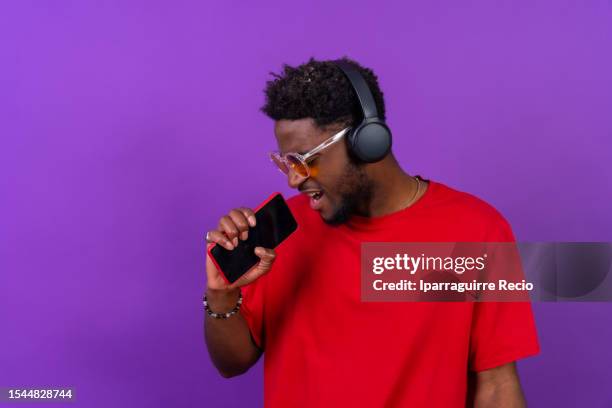 rapper holding microphone photos and premium high res... 1,326 Rapper Holding Microphone Stock Photos, High-Res Pictures, and ...