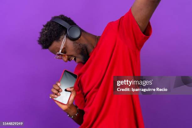 rapper holding microphone photos and premium high res... 1,326 Rapper Holding Microphone Stock Photos, High-Res Pictures, and ...
