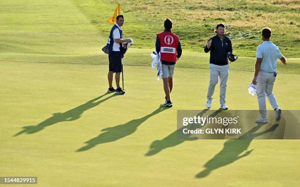 Spain's Adri Arnaus congratulates Scotland's Ewen Ferguson on the 18th hole on day one of the 151st British Open Golf Championship at Royal Liverpool...