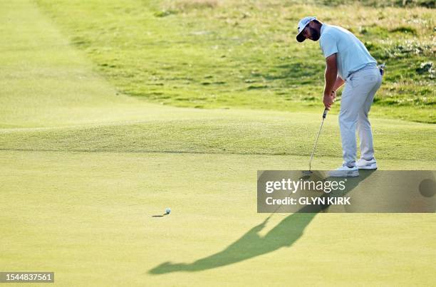 Spain's Adri Arnaus putts on the 18th green on day one of the 151st British Open Golf Championship at Royal Liverpool Golf Course in Hoylake, north...