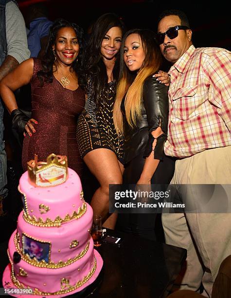 Tina Douglas, Ashanti, Shia Douglas and Kenkaide attend the birthday celebration of Ashanti hosted by Nelly at Reign Nightclub on October 12, 2012 in...