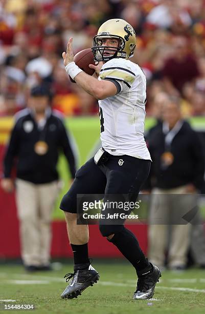 Quarterback Jordan Webb of the Colorado Buffaloes drops back to pass against the USC Trojans in the second quarter at Los Angeles Memorial Coliseum...